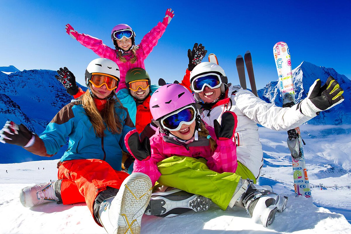 Family enjoy vacation on Austrian Alps on the snow