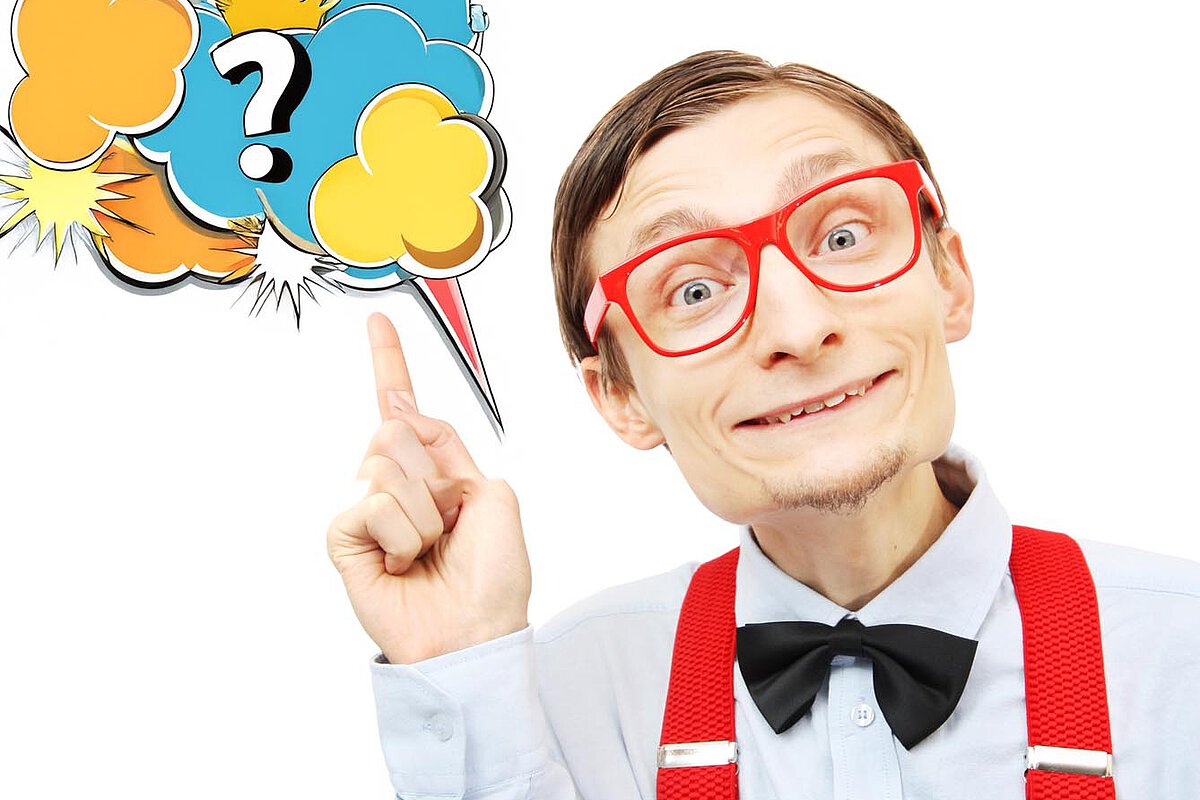 A person with red glasses and suspenders pointing at a colorful speech bubble with a question mark. This image redirect to the FAQs page of this website.